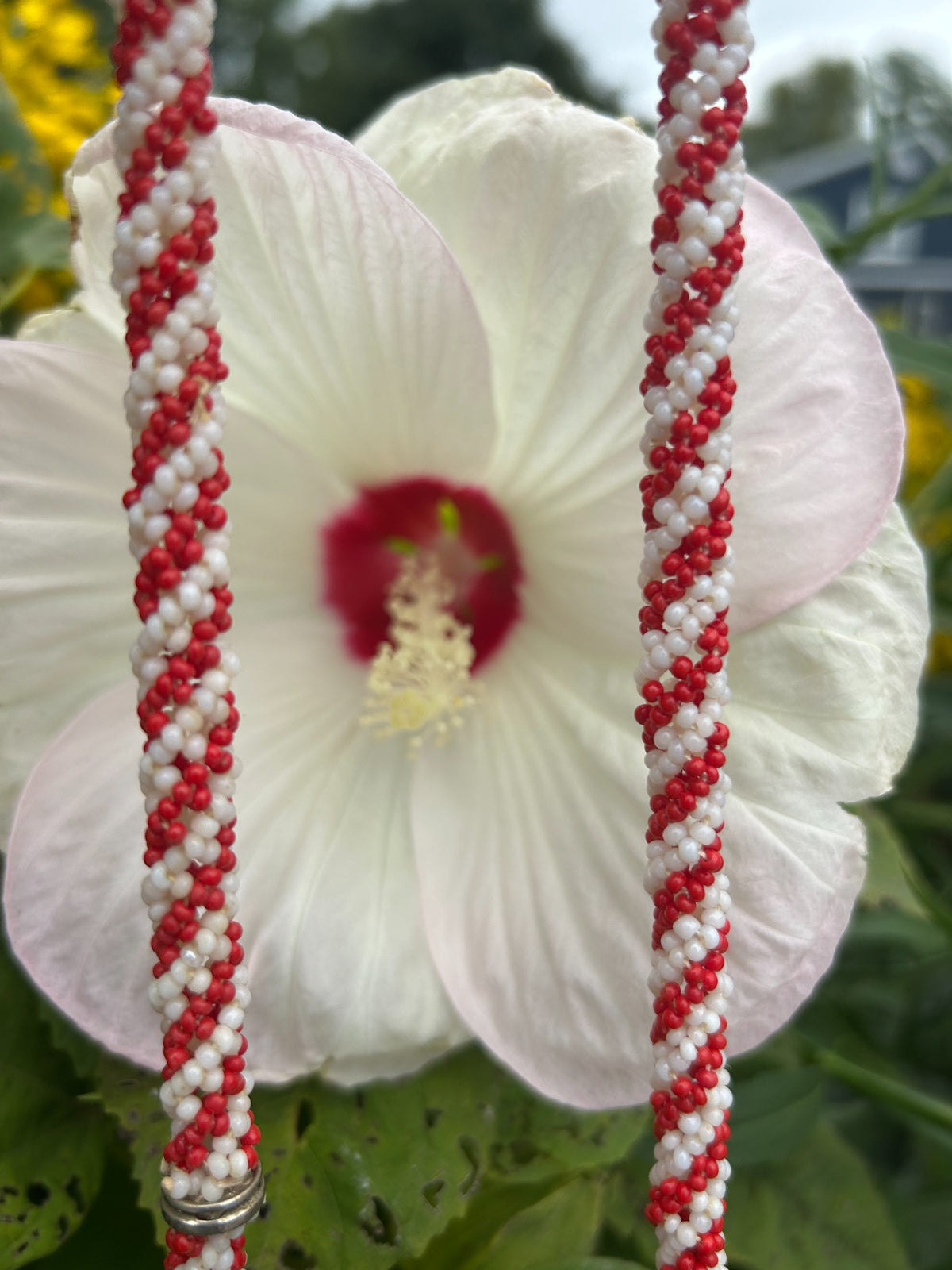 Close-up of vintage red and white spiral seed bead necklace
