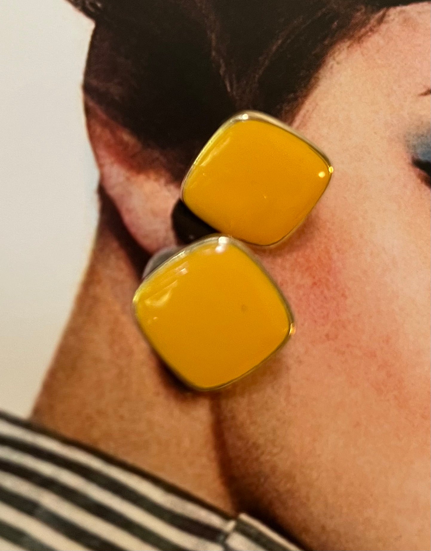 Vintage yellow cabochon gold-tone earrings close-up