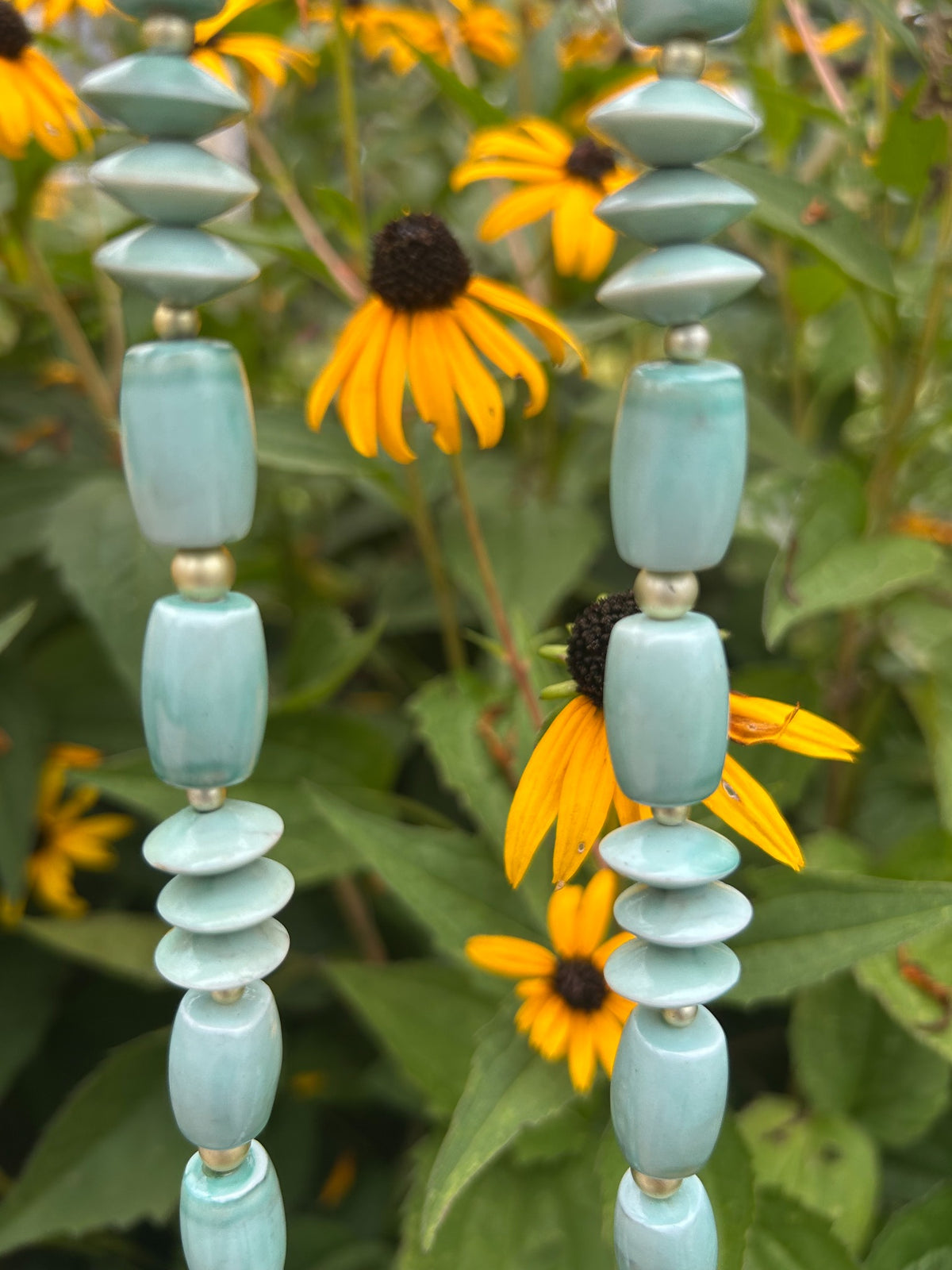 Close-up of vintage aqua geometric bead necklace