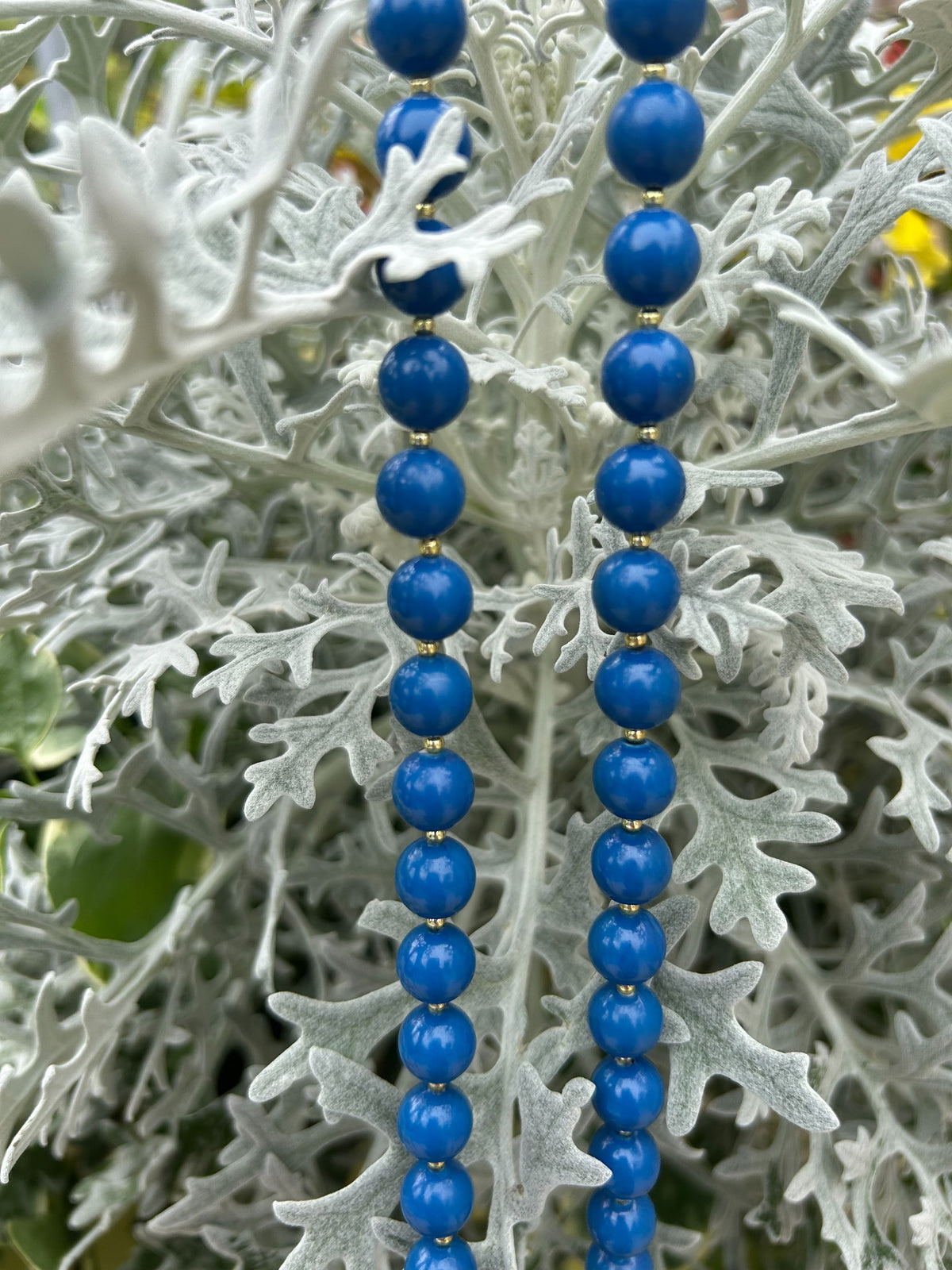Close-up of vintage cobalt blue round bead necklace