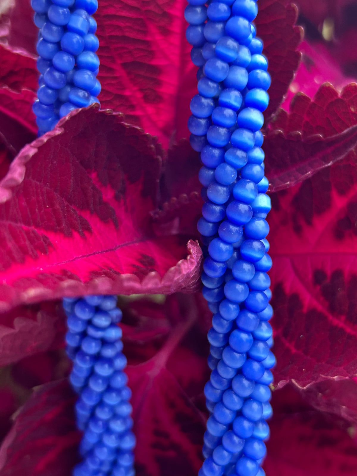Close-up of vintage cobalt blue seed bead rope necklace
