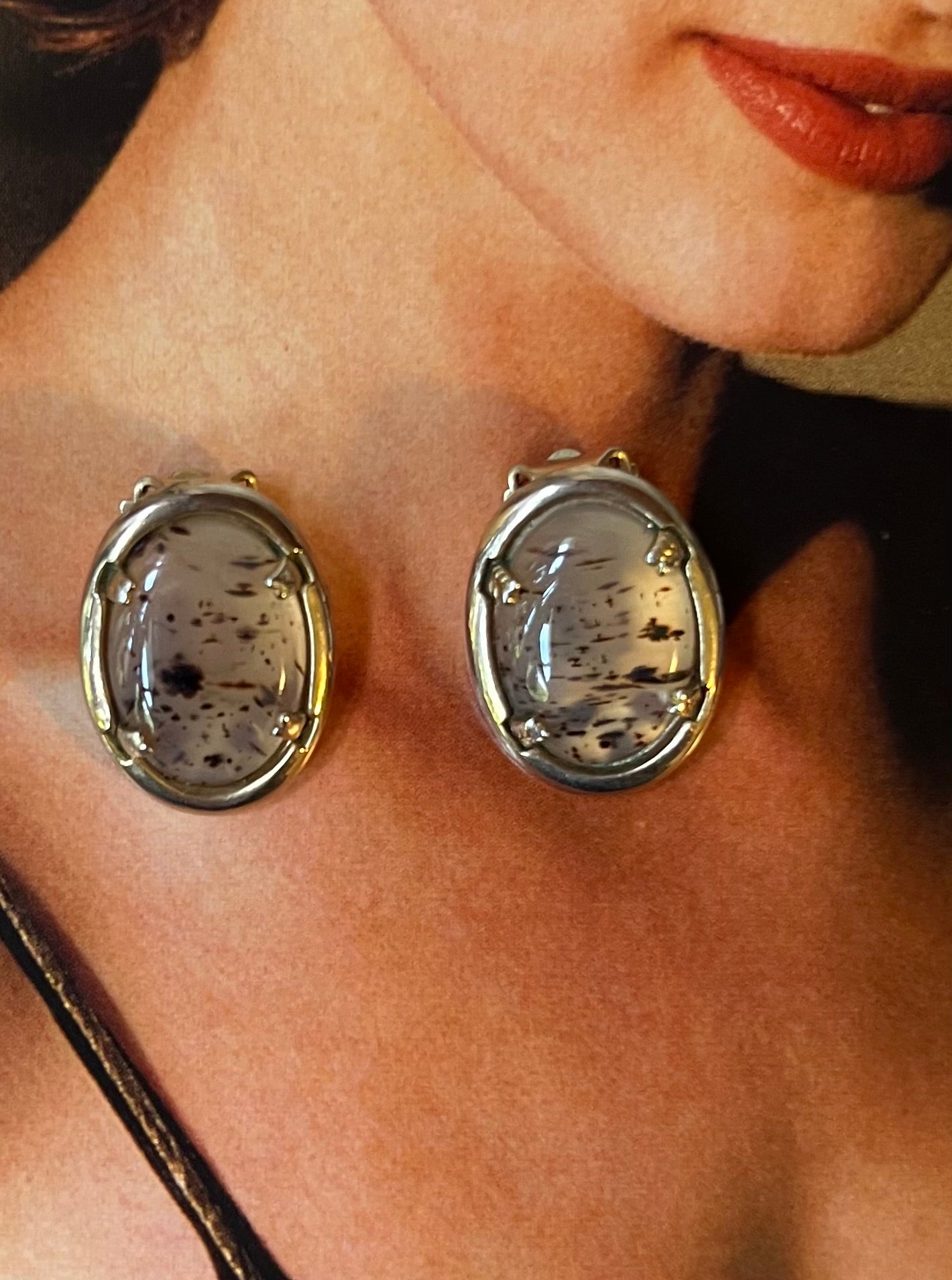 Close-up vintage oval dendritic-style cabochon earrings
