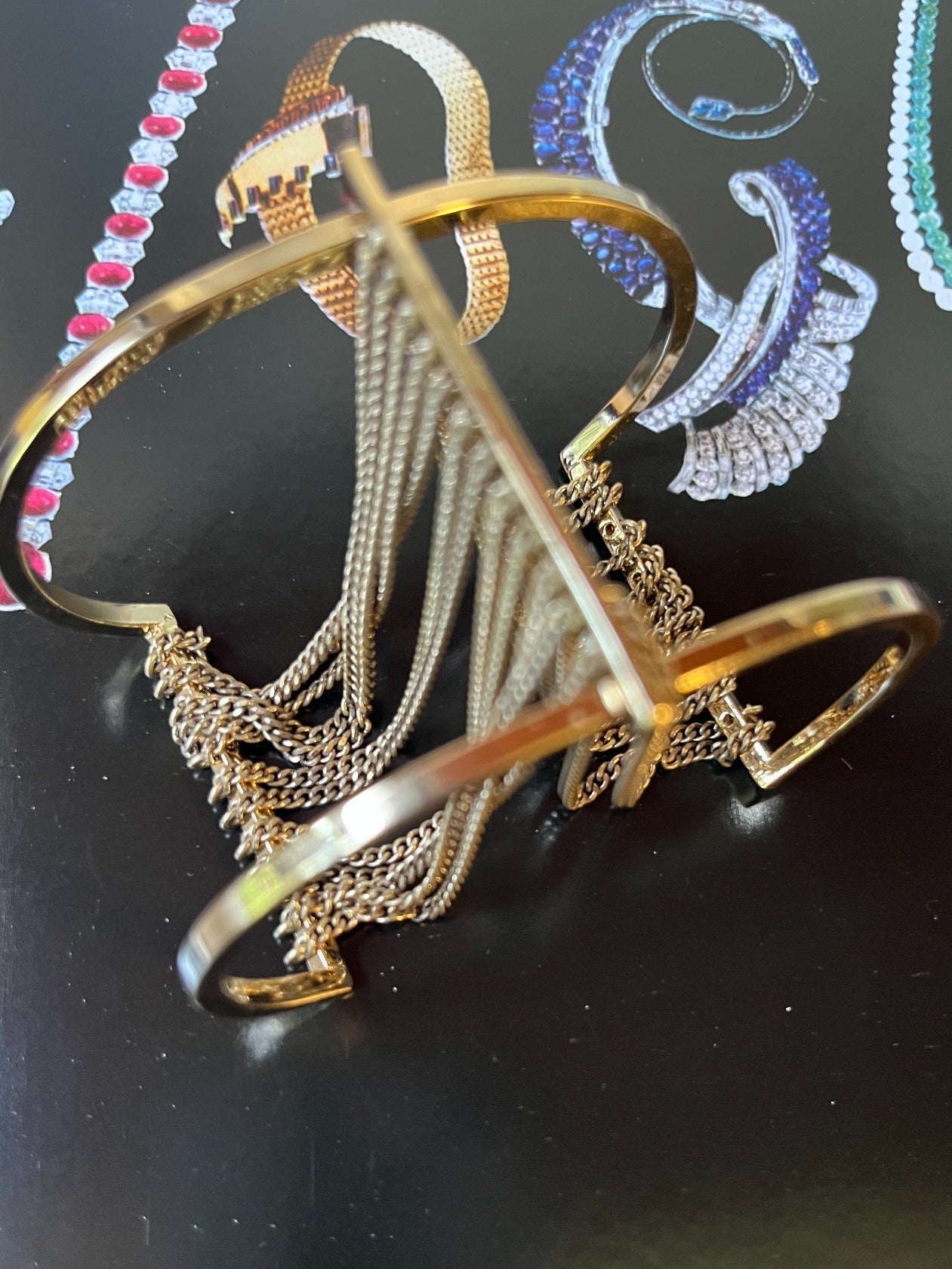 Close-up vintage gold-tone chain fringe cuff bracelet