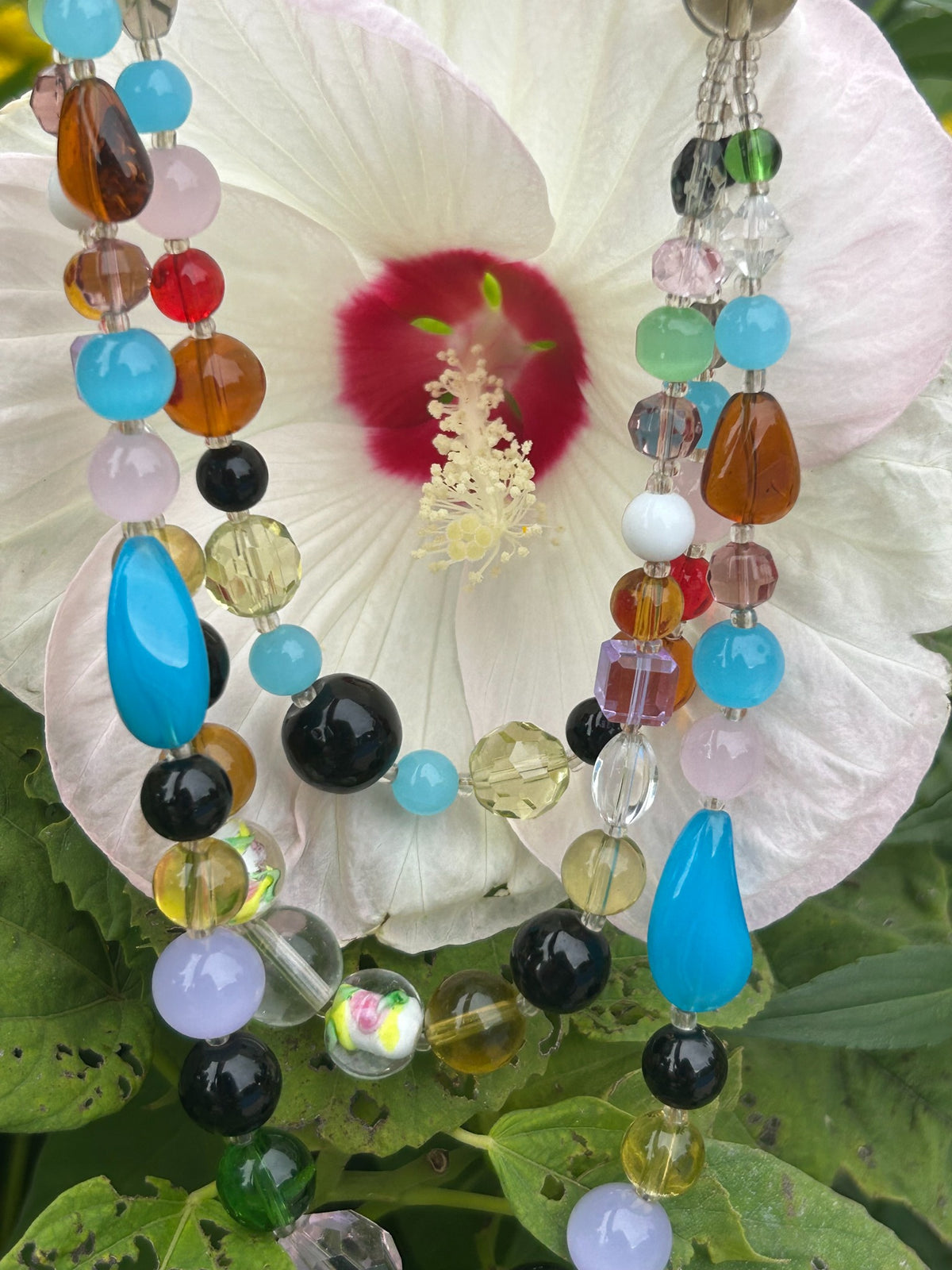 Close-up of vintage multicolour mixed glass bead necklace
