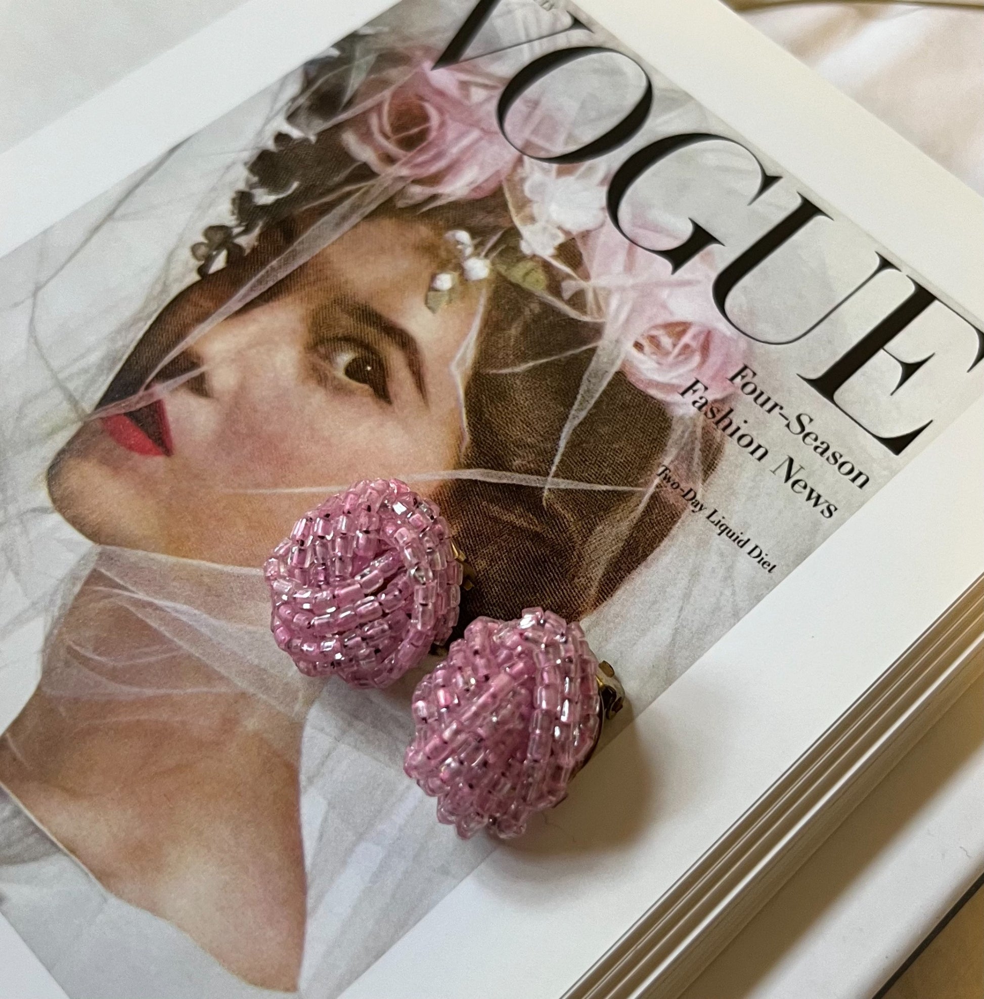 Close-up vintage pink beaded cluster earrings