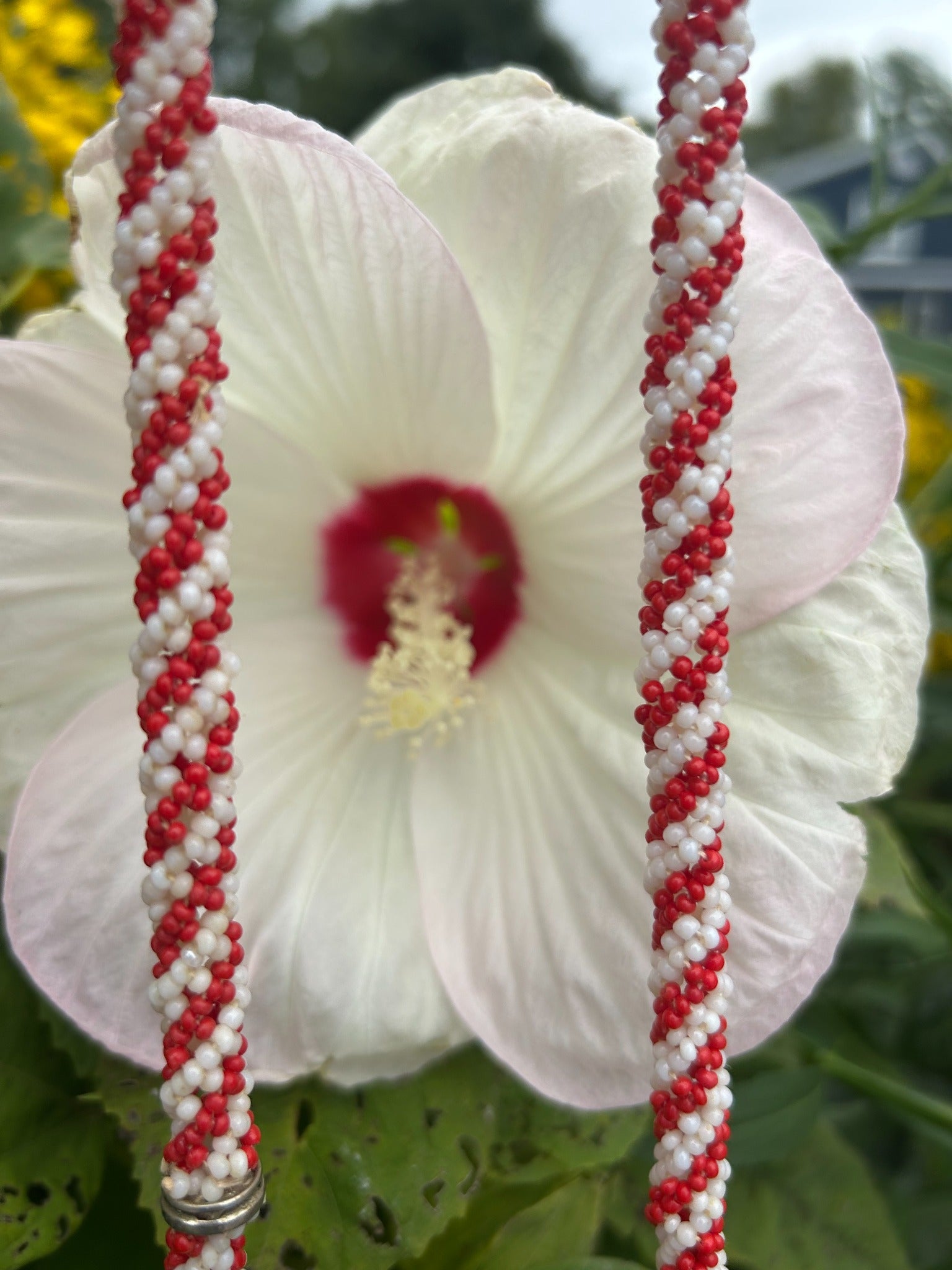 Close-up of vintage red and white spiral seed bead necklace