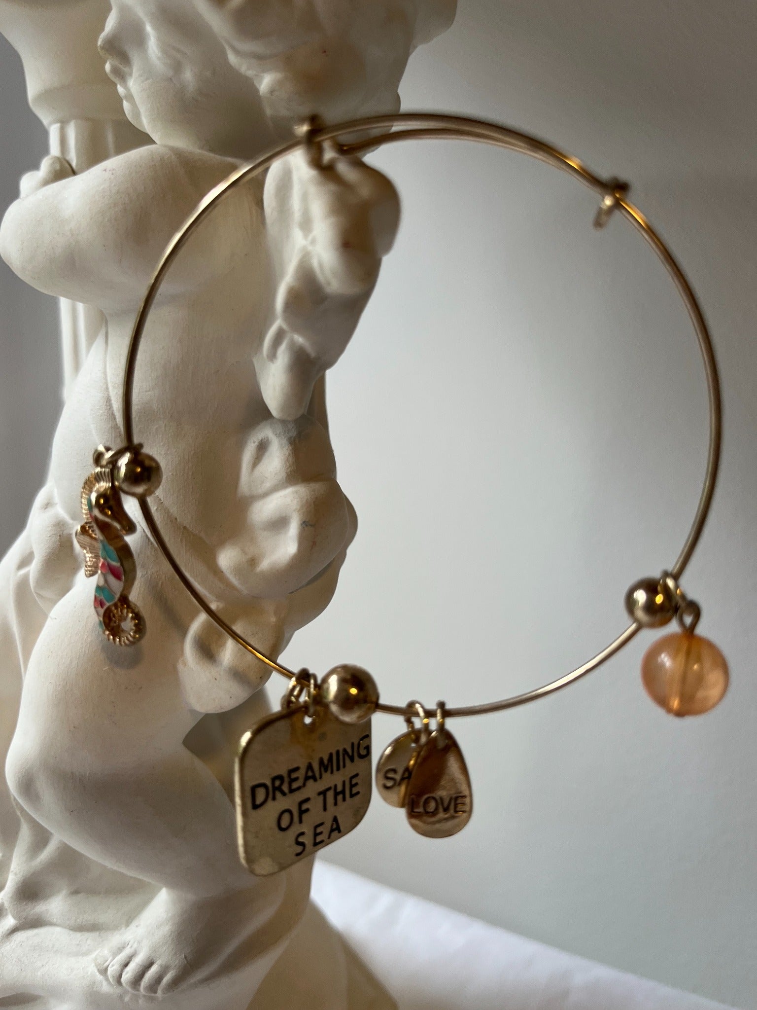 Gold-tone seaside charm bangle bracelet
