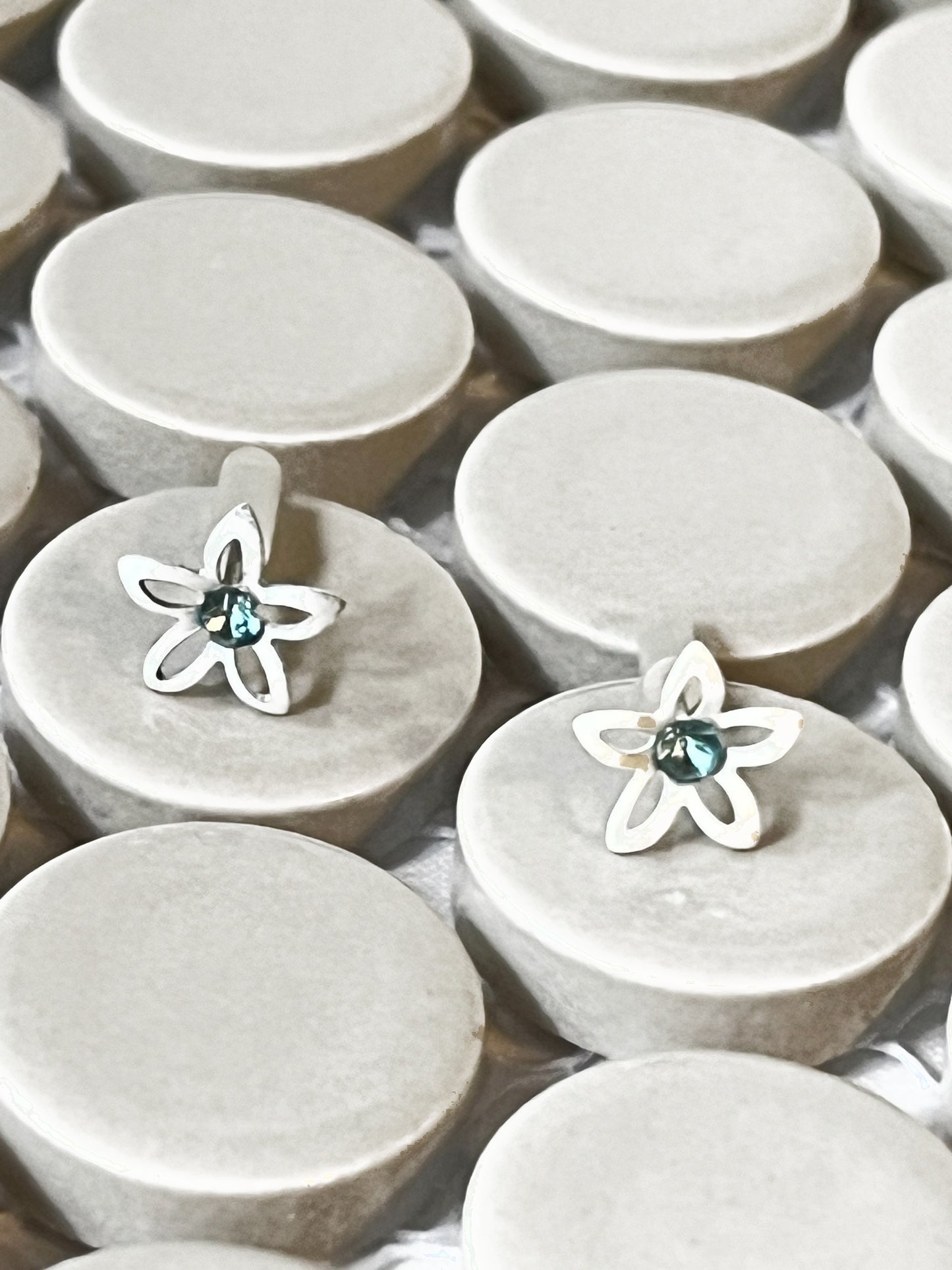 Vintage silver-tone flower earrings with blue crystal centres